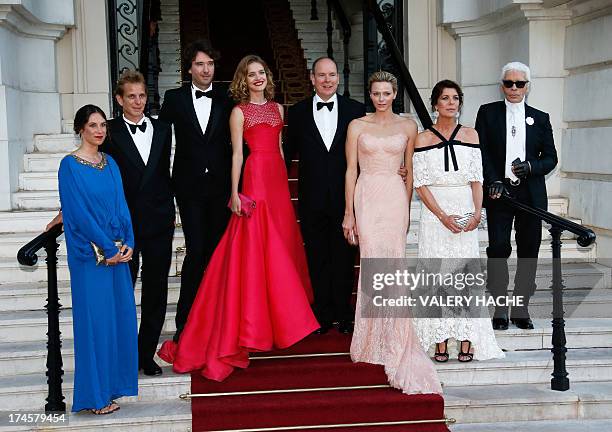 Prince's Albert II of Monaco and his wife, Princess Charlene of Monaco pose with Russian model and founder of "Naked Heart Foundation", Natalia...