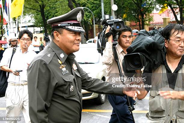 Pol. Maj. Gen. Pramoj Pathumwon, Commander of Metropolitan Police Division 1, leaves the Army headquarters, the morning after Thai armed forces...