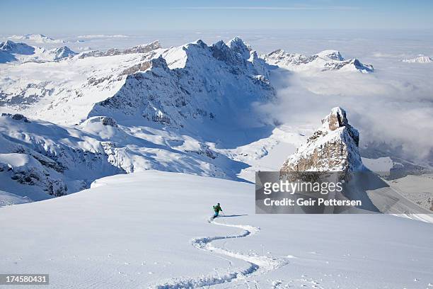 off-piste skier in powder snow - winter sport stock-fotos und bilder