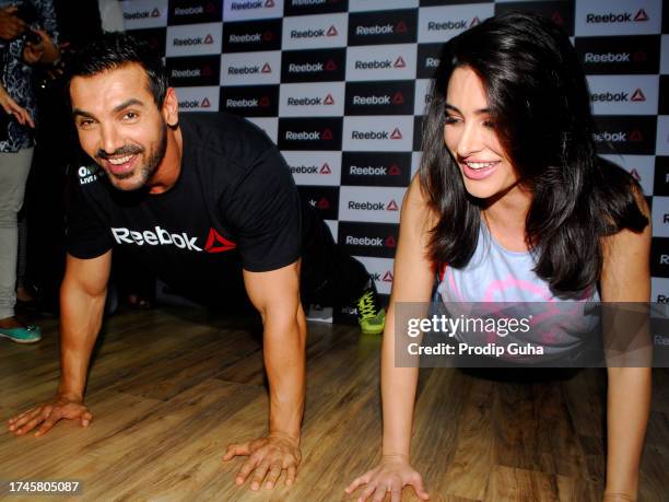 John Abraham and Nargis Fakhri attend the launch of a fitness studio on September 01,2014 in Mumbai, India