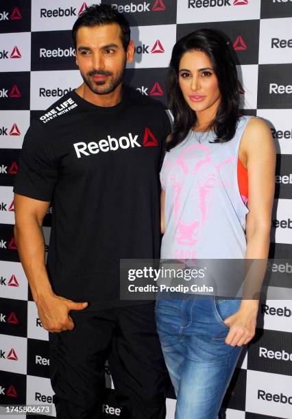 John Abraham and Nargis Fakhri attend the launch of a fitness studio on September 01,2014 in Mumbai, India