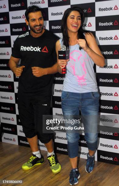 John Abraham and Nargis Fakhri attend the launch of a fitness studio on September 01,2014 in Mumbai, India