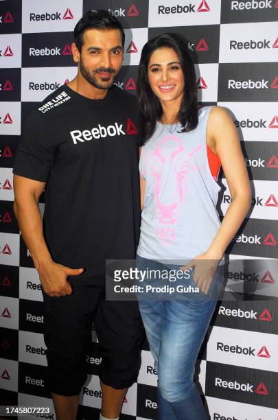 John Abraham and Nargis Fakhri attend the launch of a fitness studio on September 01,2014 in Mumbai, India
