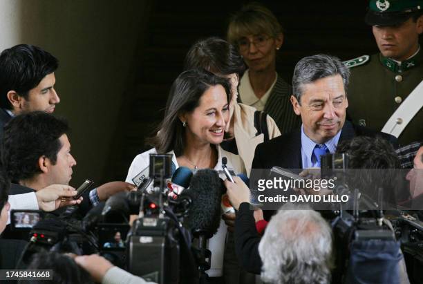 Former Socialist presidential candidate Segolene Royal talks with the media next to Chilean Socialist Senator Carlos Ominami after meeting Chile's...