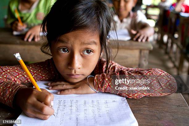 asian girl studying hard at school - very young thai girls stock pictures, royalty-free photos & images