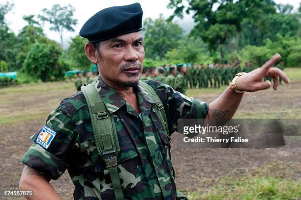 Na Kham Mwe, commander of the Brigade 5 of the Democratic Karen Buddhist Army during a training session for recruits. Walks in a village.The DKBA...