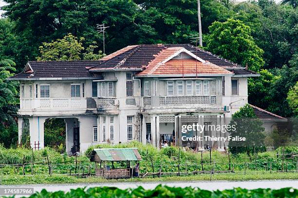 View of the house of Burmese opposition icon and Nobel Peace Prize Aung San Suu Kyi. Workers are seen fixing up the house which sustained major...