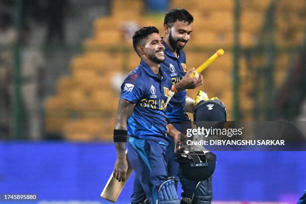 Sri Lanka's Sadeera Samarawickrama and Pathum Nissanka walk back to the pavilion after winning the 2023 ICC Men's Cricket World Cup one-day...