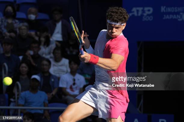 Ben Shelton of the United States returns a shot against Tommy Paul of the United States in the men's singles quarterfinal match during day five of...