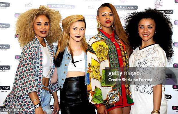 Jessica Plummer, Asami Zdrenka, Amira McCarthy and Shereen Cutkelvin of Neon Jungle pose backstage at Radio City Live at Echo Arena on July 27, 2013...