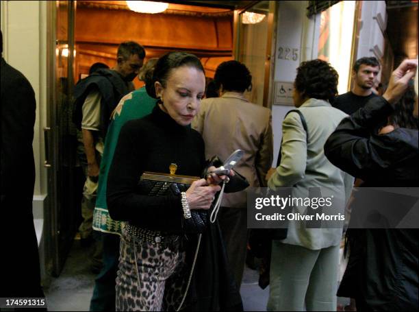 An unidentified femlae theatergoer checking her cell phone during an intermisson of a show at the Schubert Theater , Times Square, Manhattan, New...