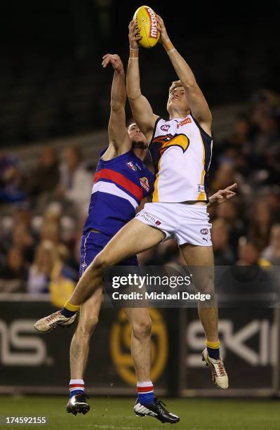 Blayne Wilson of the Eagles marks the ball against Jarrad Grant of the Bulldogs during the round 18 AFL match between the Western Bulldogs and the...