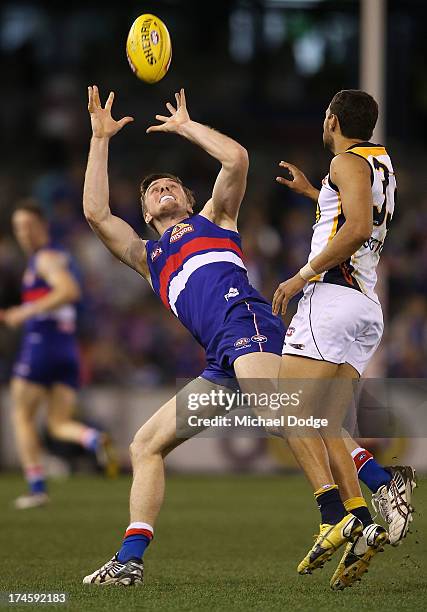 Jordan Roughead marks the ball against Josh Hill of the Eagles during the round 18 AFL match between the Western Bulldogs and the West Coast Eagles...