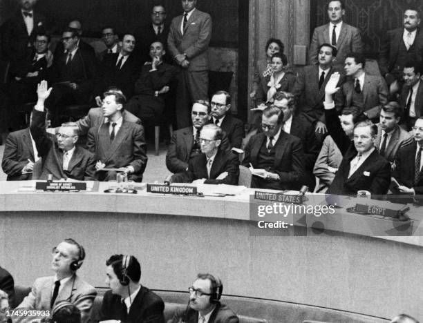 For the first time since a long time USSR UN delegate Arkadi Sobolev and USA UN delegate Henry Cabot Lodge raise their hands together during the UN...