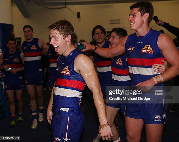 Lachie Hunter of the Bulldogs celebrates his first win with the club during the round 18 AFL match between the Western Bulldogs and the West Coast...