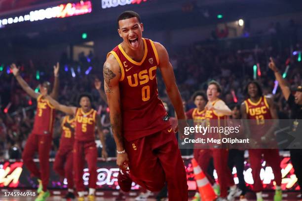 Kobe Johnson of the USC Trojans reacts after making a half court shot during the USC Trojan HoopLA event at Galen Center on October 19, 2023 in Los...