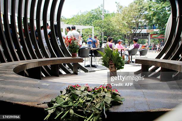 Flowers are left at the site for victims two days after a bomb attack at a popular restaurant in Cagaya de Oro on the southern Philippine island of...