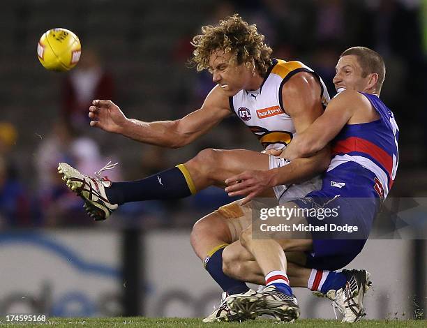 Matthew Boyd of the Bulldogs tackles Matt Priddis of the Eagles during the round 18 AFL match between the Western Bulldogs and the West Coast Eagles...