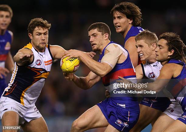 Tom Liberatore of the Bulldogs contests for the ball during the round 18 AFL match between the Western Bulldogs and the West Coast Eagles at Etihad...