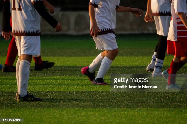 playing football soccer - studded footwear stock pictures, royalty-free photos & images