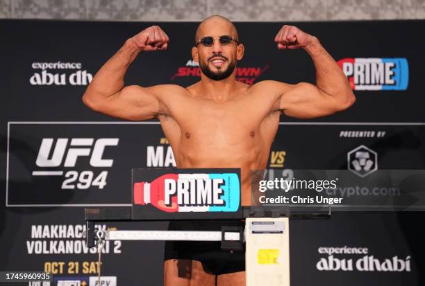 Abu Azaitar of Germany poses on the scale during the UFC 294 official weigh-in at the Hilton Yas Island on October 20, 2023 in Abu Dhabi, United Arab...