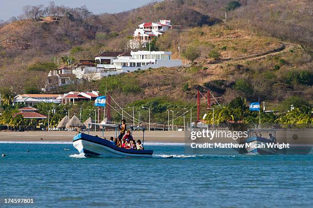 a boat tour leaves san juan harbor - southampton parish stock pictures, royalty-free photos & images