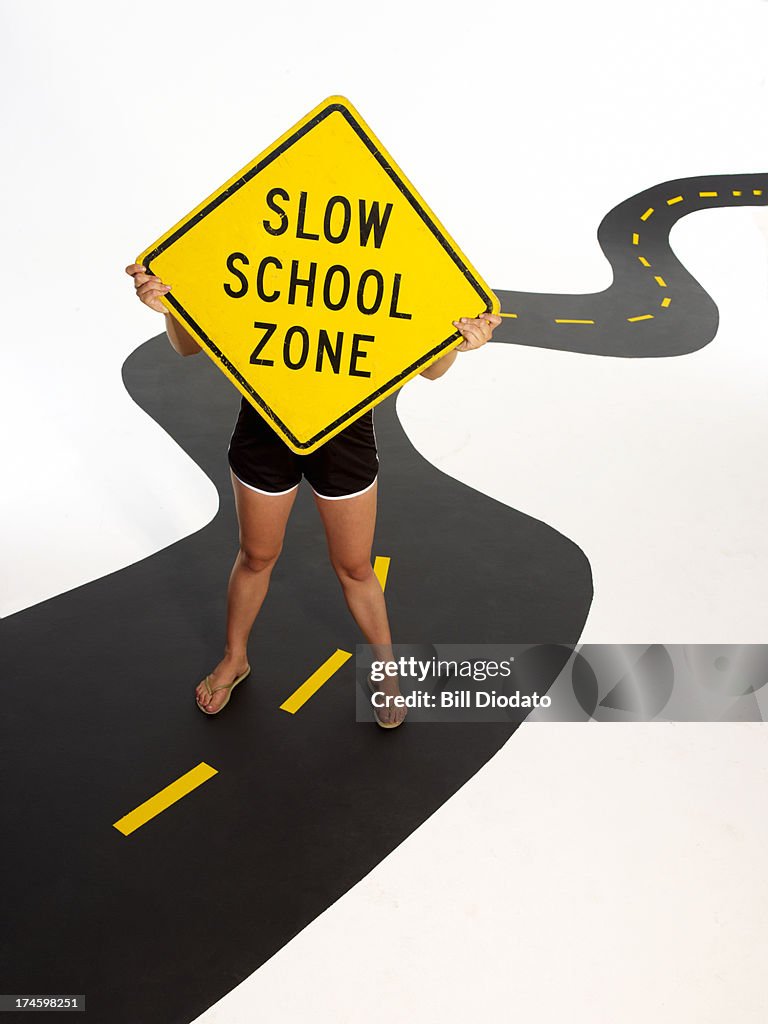 Woman holding sign