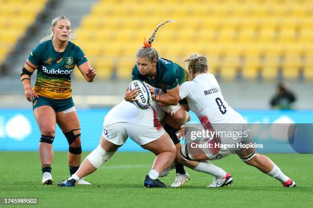 Georgina Friedrichs of Australia is tackled during the WXV1 Match between England and Australia Wallaroos at Sky Stadium on October 20, 2023 in...