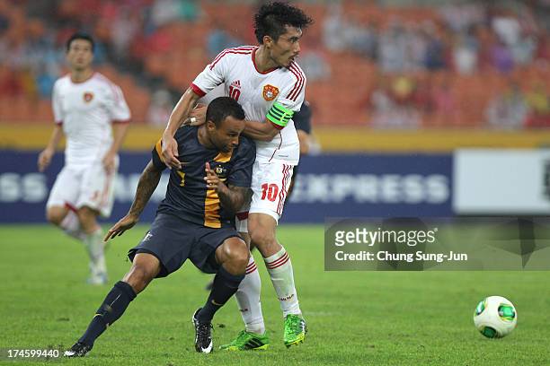 Archie Thompson of Australia compete for the ball with Zheng Zhi of China during the EAFF East Asian Cup match between Australia and China at Jamsil...