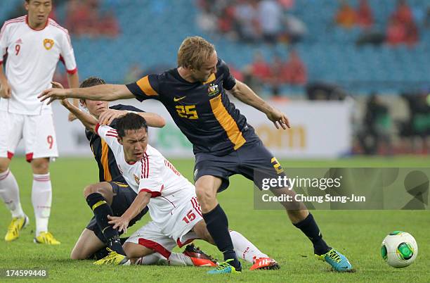 Mitchell Nichols of Australia competes for the ball with Wu Xi of China during the EAFF East Asian Cup match between Australia and China at Jamsil...