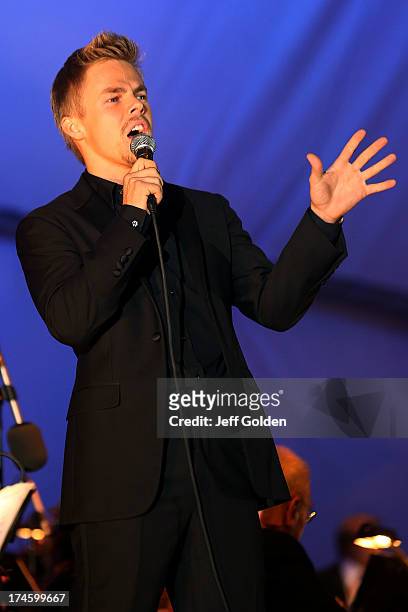 Derek Hough sings "Feeling Good" during the California Philharmonic Festival on the Green at Santa Anita Race Track on July 27, 2013 in Arcadia,...