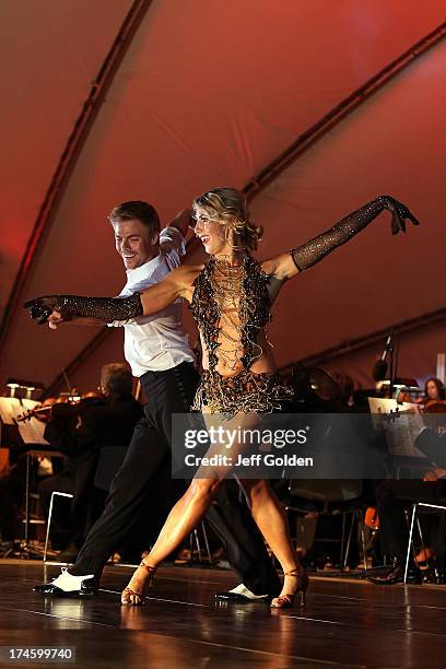 Derek Hough dances with partner Emma Slater to Glenn Miller's "In The Mood" during the California Philharmonic Festival on the Green at Santa Anita...