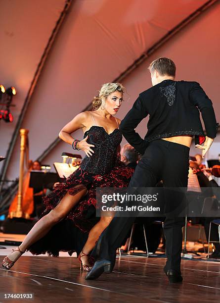 Emma Slater dances with partner Derek Hough during the California Philharmonic Festival on the Green at Santa Anita Race Track on July 27, 2013 in...