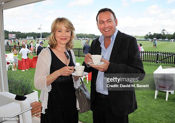 Beth Goddard and Philip Glenister attend the Audi International Polo at Guards Polo Club on July 28, 2013 in Egham, England.