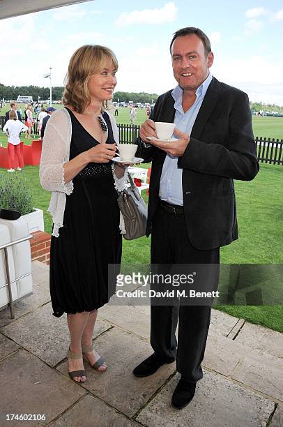 Beth Goddard and Philip Glenister attend the Audi International Polo at Guards Polo Club on July 28, 2013 in Egham, England.
