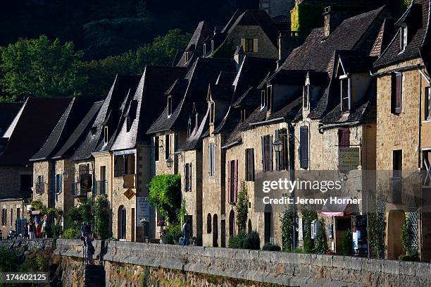 La Roque Gageac flanks the Dordogne River in the Perigord Noir..