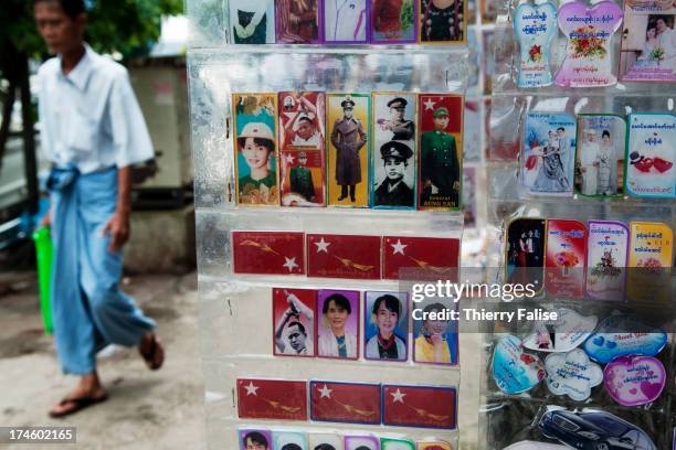 Plastic plates bearing portraits of Aung San Suu Kyi and her father Aung San, founder of the country's independence, are sold in a Yangon street..