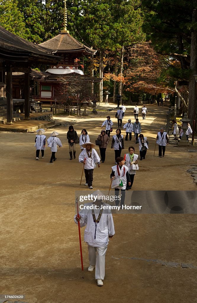 Pilgrims dressed in white approach the Danjo Garan Complex...