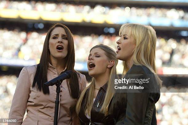 The Dixie Chicks perform the National Anthem before the start of Super Bowl XXXVII between the Tampa Bay Buccaneers and the Oakland Raiders on...