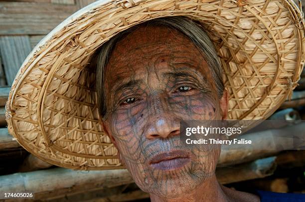 Chin ethnic woman with her face heavily tattooed..
