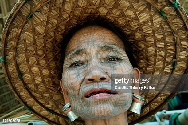 Chin ethnic woman with her face heavily tattooed..