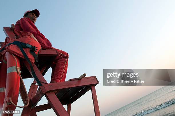 Life guard sits on the Cox's Bazar beach..