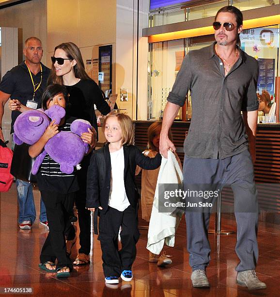 Brad Pitt, Angelina Jolie and their children Pax, Knox and Vivienne arrive at Tokyo International Airport on July 28, 2013 in Tokyo, Japan.