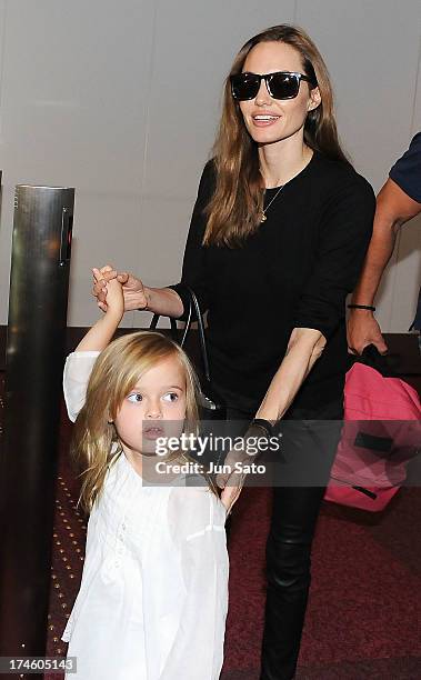 Angelina Jolie and Vivienne Jolie-Pitt arrive at Tokyo International Airport on July 28, 2013 in Tokyo, Japan.