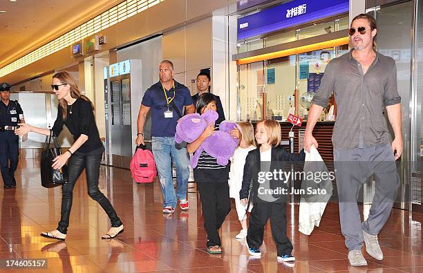 Brad Pitt, Angelina Jolie and their children Pax, Knox and Vivienne arrive at Tokyo International Airport on July 28, 2013 in Tokyo, Japan.