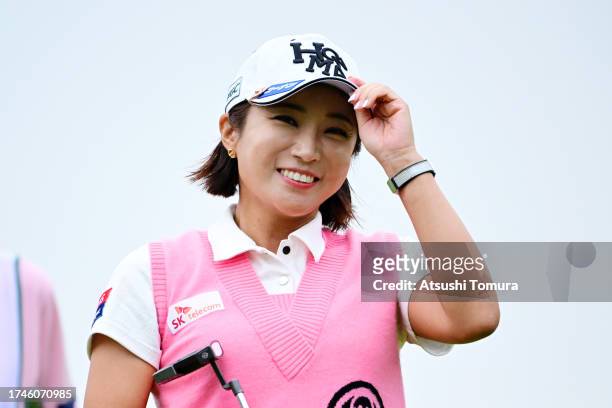 Bo-mee Lee of South Korea smiles after holing out as she is retiring from the JLPGA tour on the 18th green during the second round of NOBUTA Group...