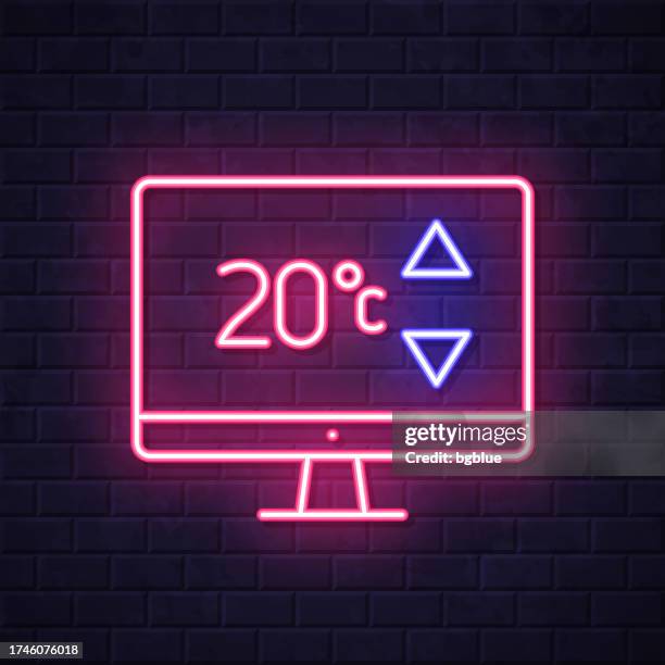 desktop computer with heating control. glowing neon icon on brick wall background - wall panel stock illustrations