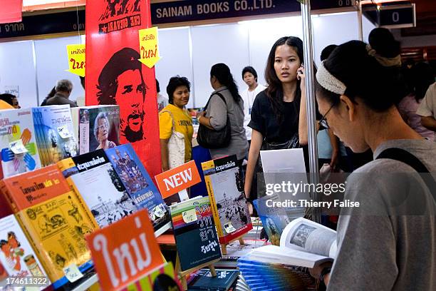 Visitors read books at the 7th Bangkok international book fair at the Queen Sirikit National Convention Center in Bangkok..