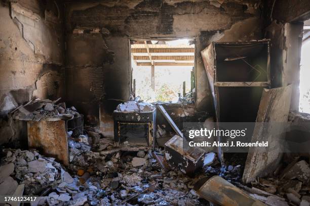 House are left burned and destroyed after Hamas militants attacked this kibbutz days earlier near the border of Gaza on October 19, 2023 in Nir Oz,...