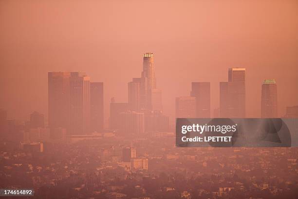 los angeles skyline on a smoggy day - smog city stock pictures, royalty-free photos & images